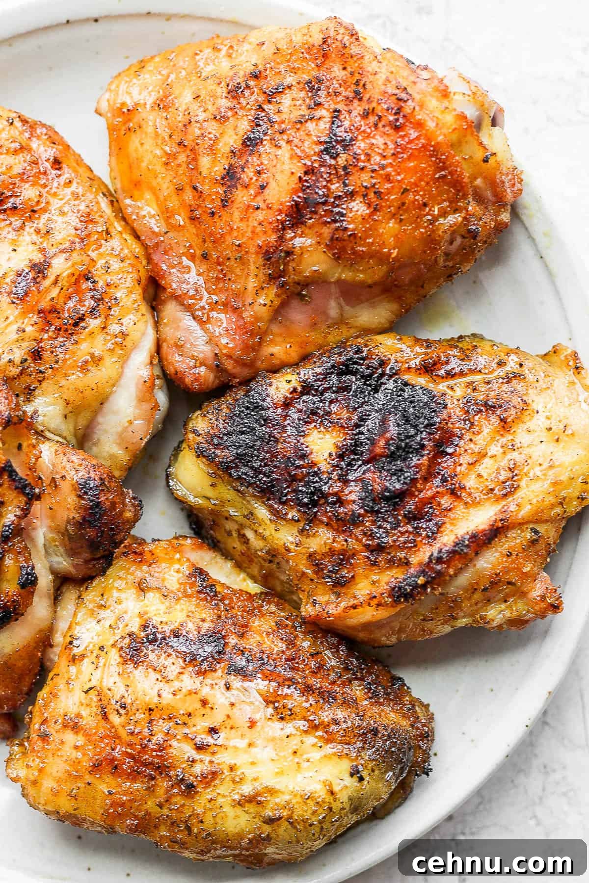 Crispy Smoked Chicken Thighs with Reverse Sear 2 Plate of smoked chicken thighs.