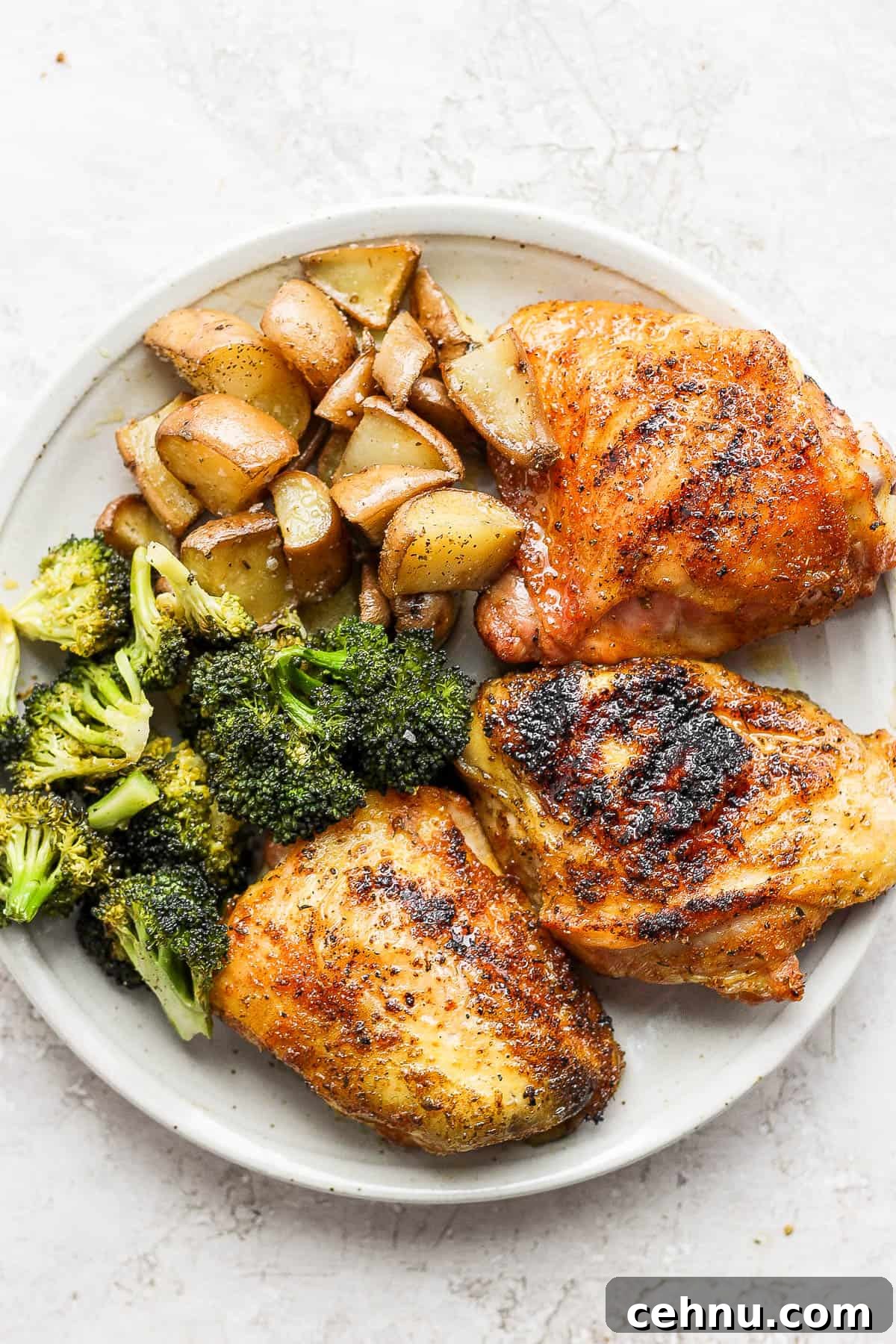 Crispy Smoked Chicken Thighs with Reverse Sear 5 A plate of smoked chicken thighs, smoked broccoli and smoked potatoes.