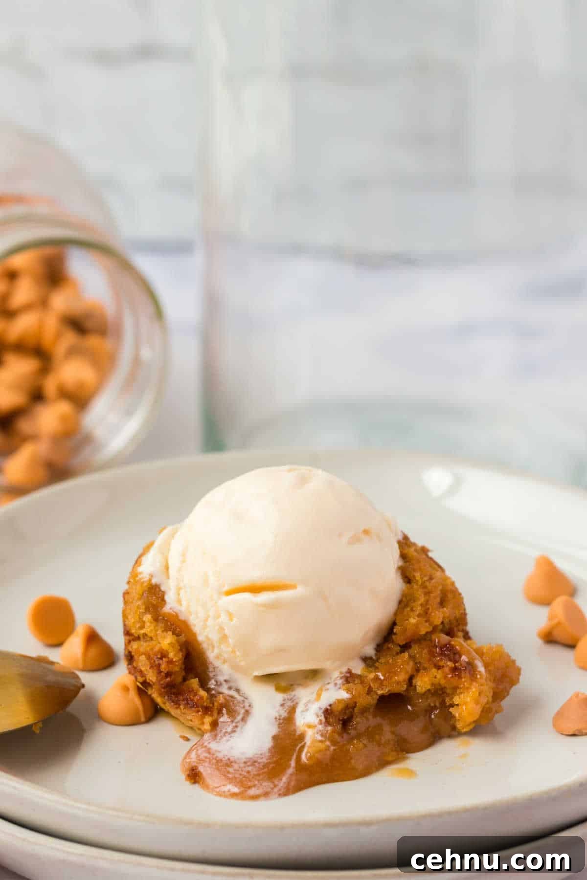 Molten Butterscotch Lava Cakes Recipe 6 The recipe cut open and topped with vanilla ice cream.