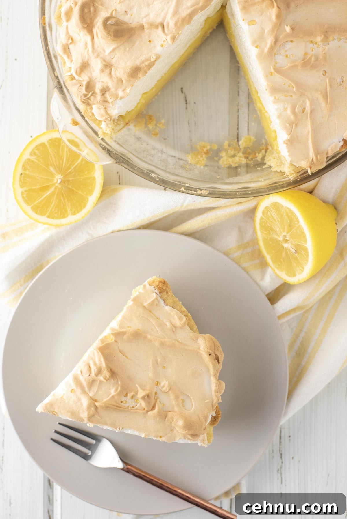 overhead shot of slice of pie on plate with rest of pie in glass dish