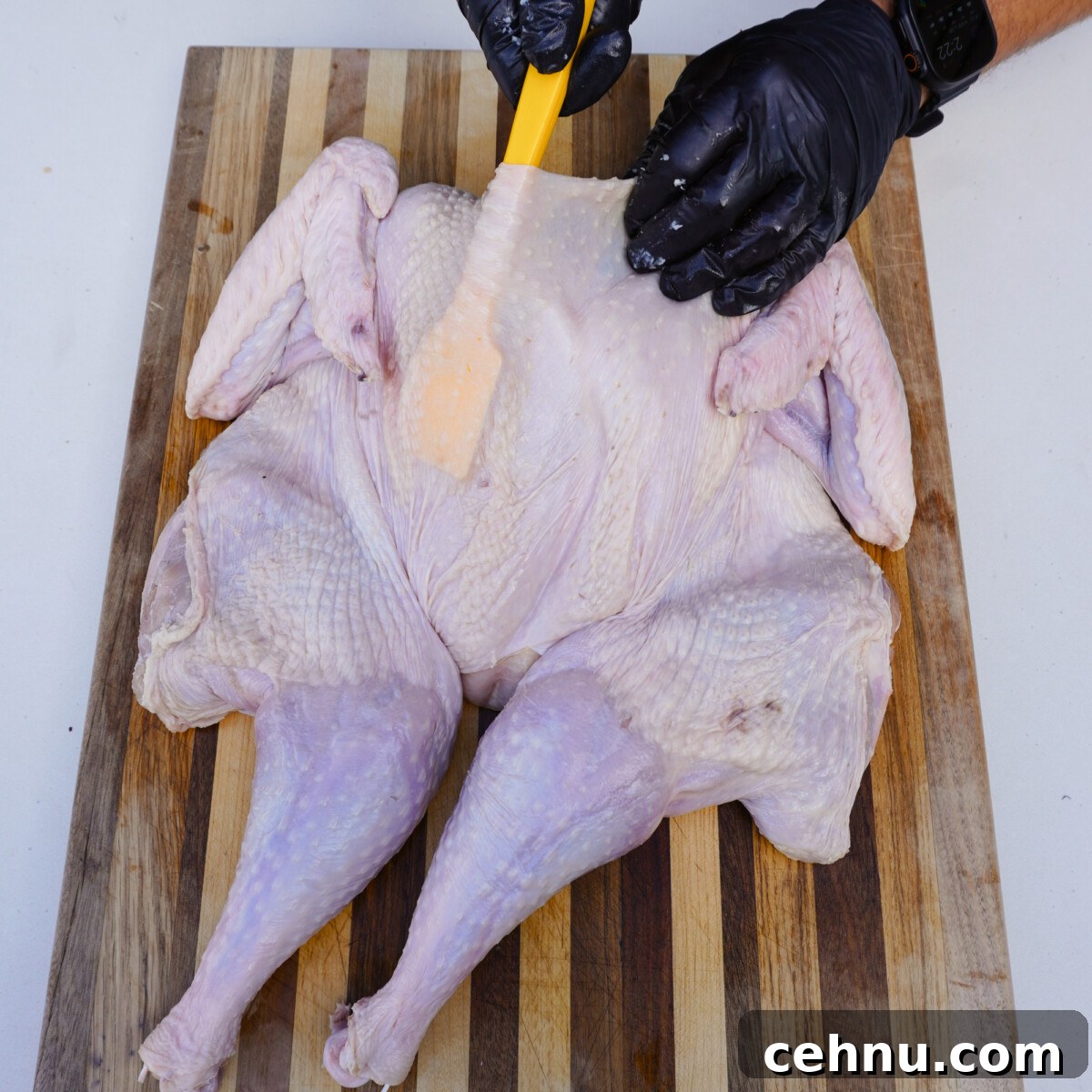 separating turkey skin from the meat.