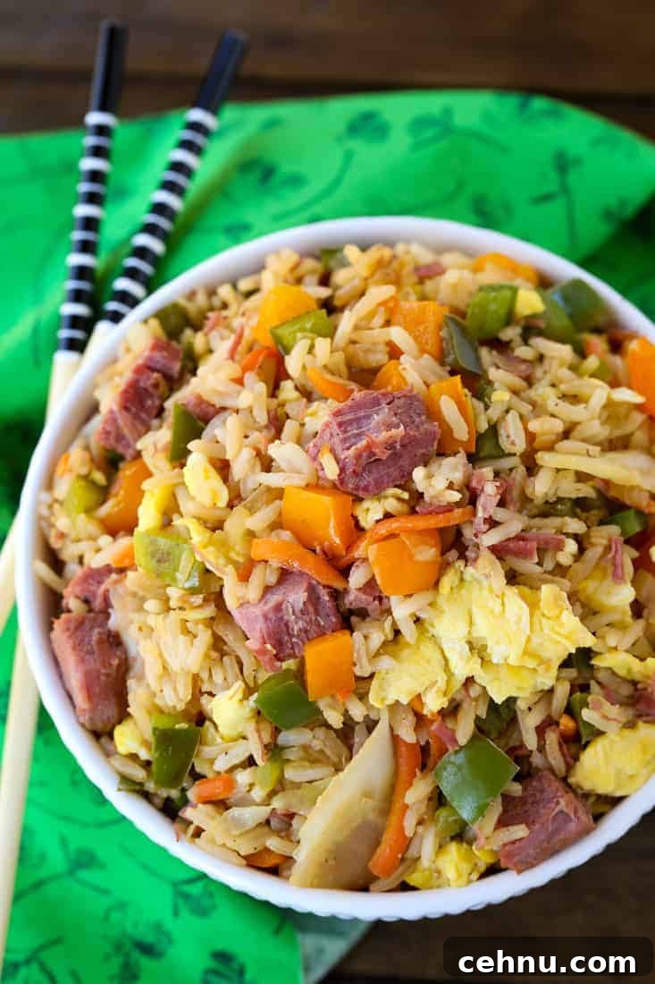 Corned Beef and Cabbage Fried Rice is such a tasty leftover corned beef recipe! Big pieces of corned beef with veggies and fluffy rice! Corned Beef and Cabbage Fried Rice is a fried rice recipe made with leftover corned beef, peppers and cabbage