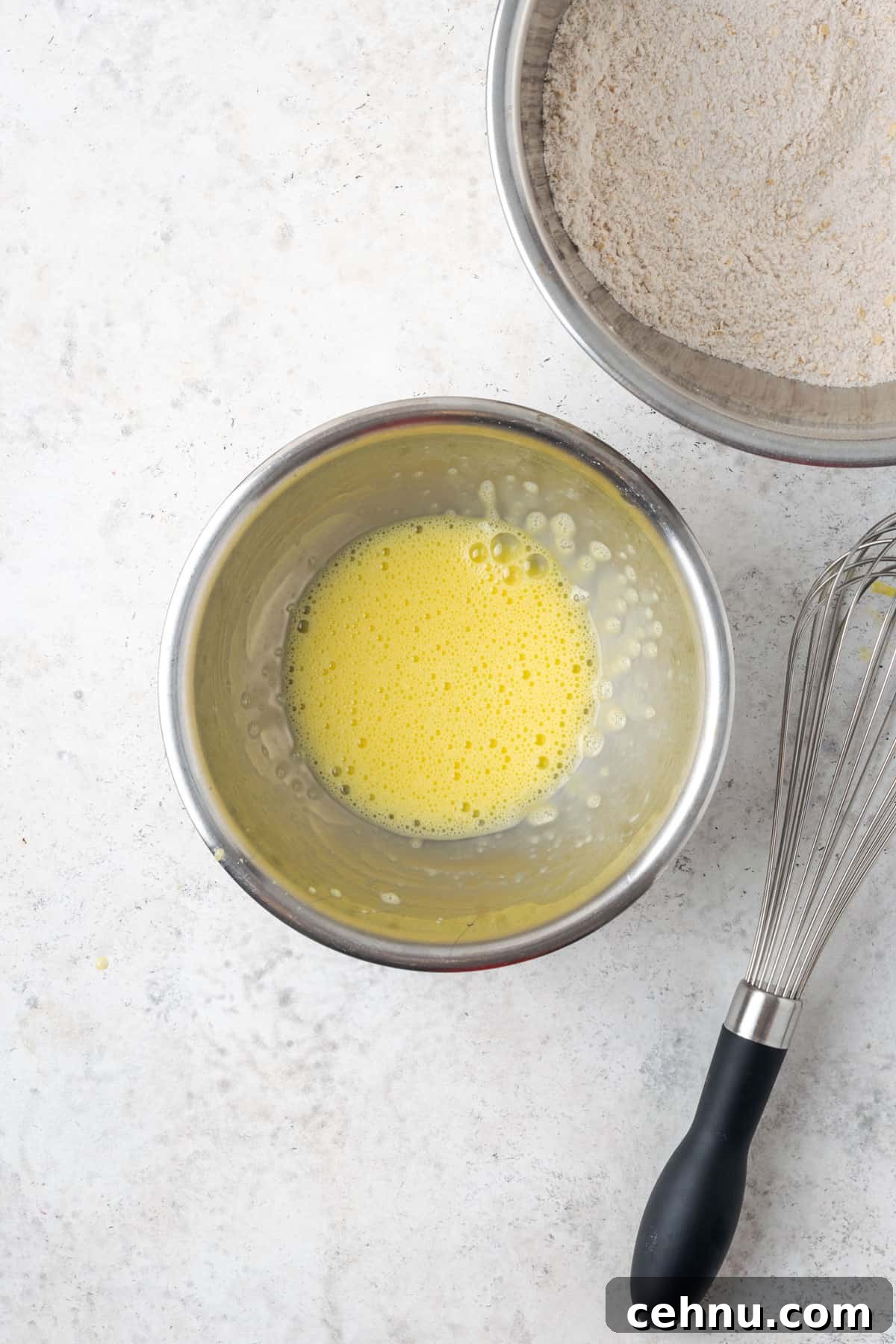 Moist Applesauce Carrot Muffin Recipe with Cinnamon 5 Beaten egg in a small metal mixing bowl.