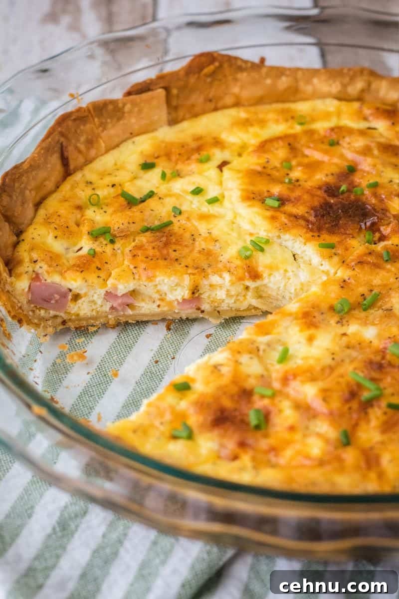Classic Ham and Cheese Quiche Recipe 2 ham cheese quiche with a slice taken out