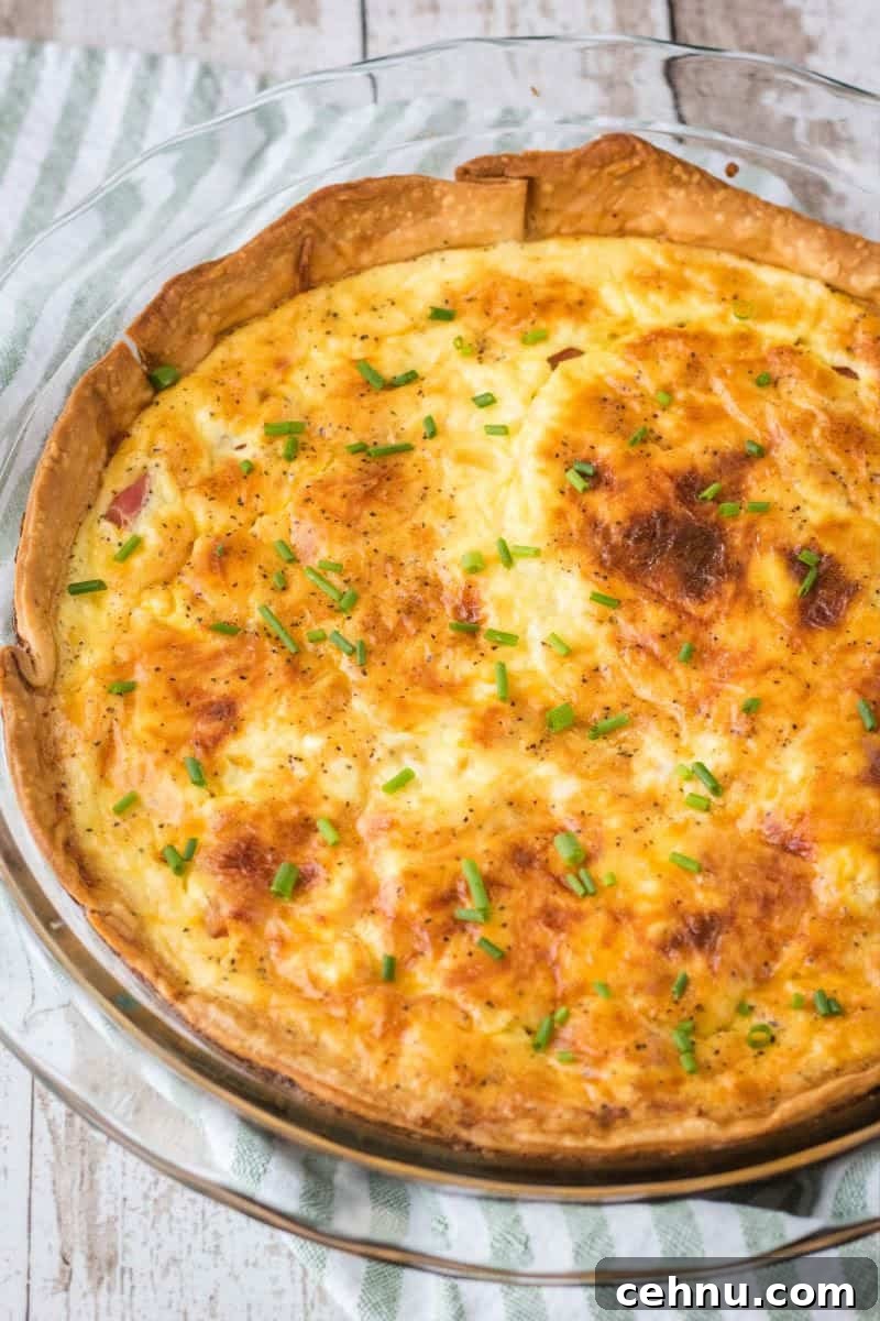 Brunch is a snap when you make this Easy Ham and Cheese Quiche! Simply prep your pie crust, pour in the filling and bake. It's practically fool-proof! ham and cheese quiche after baking