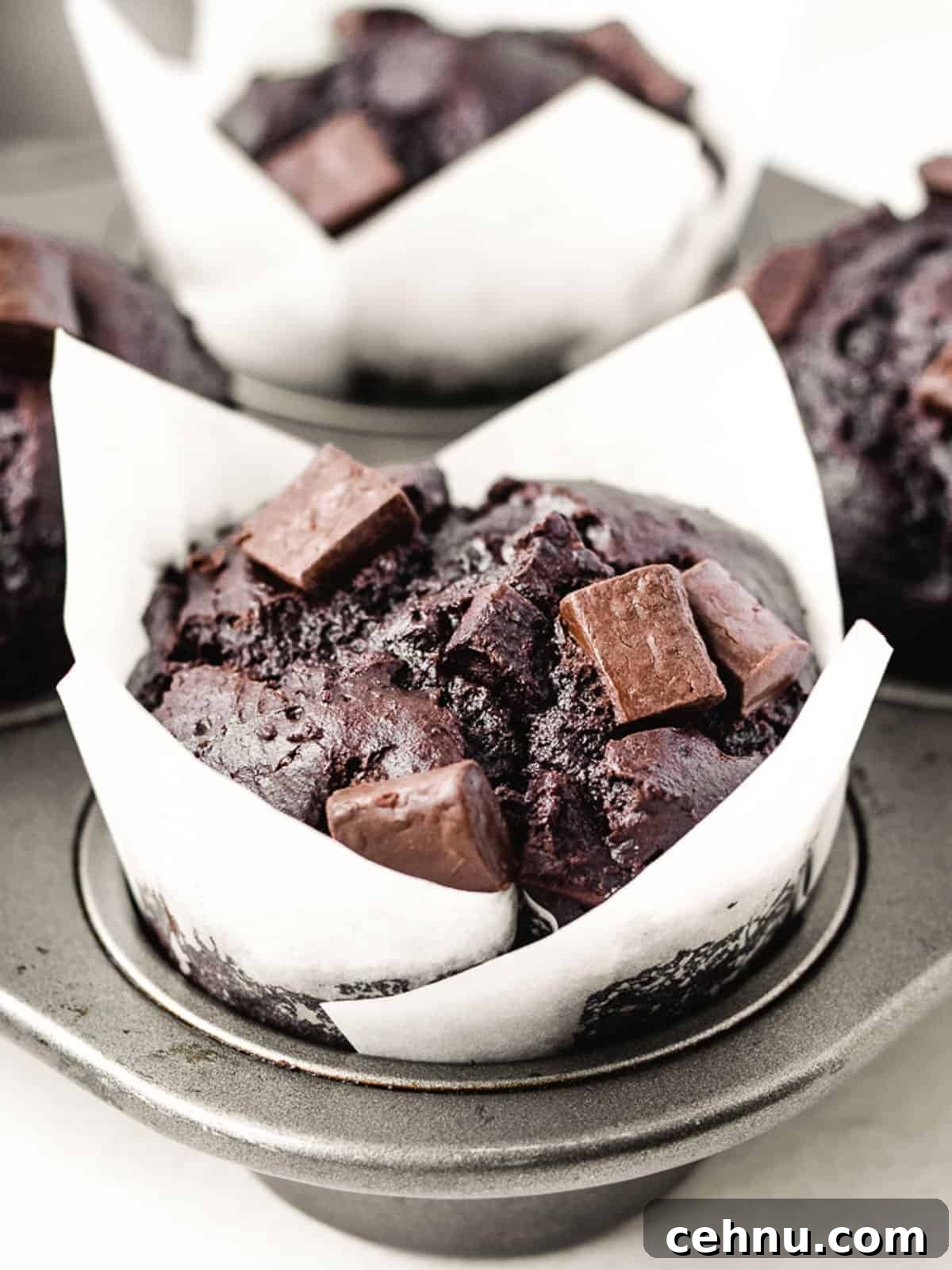 close-up of chocolate chunk muffins in a muffin tin