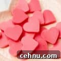 close up of keto strawberry heart-shaped gummies on a plate