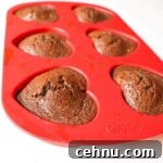 Keto Chocolate Flaxseed Muffins in red heart silicone baking pan side view