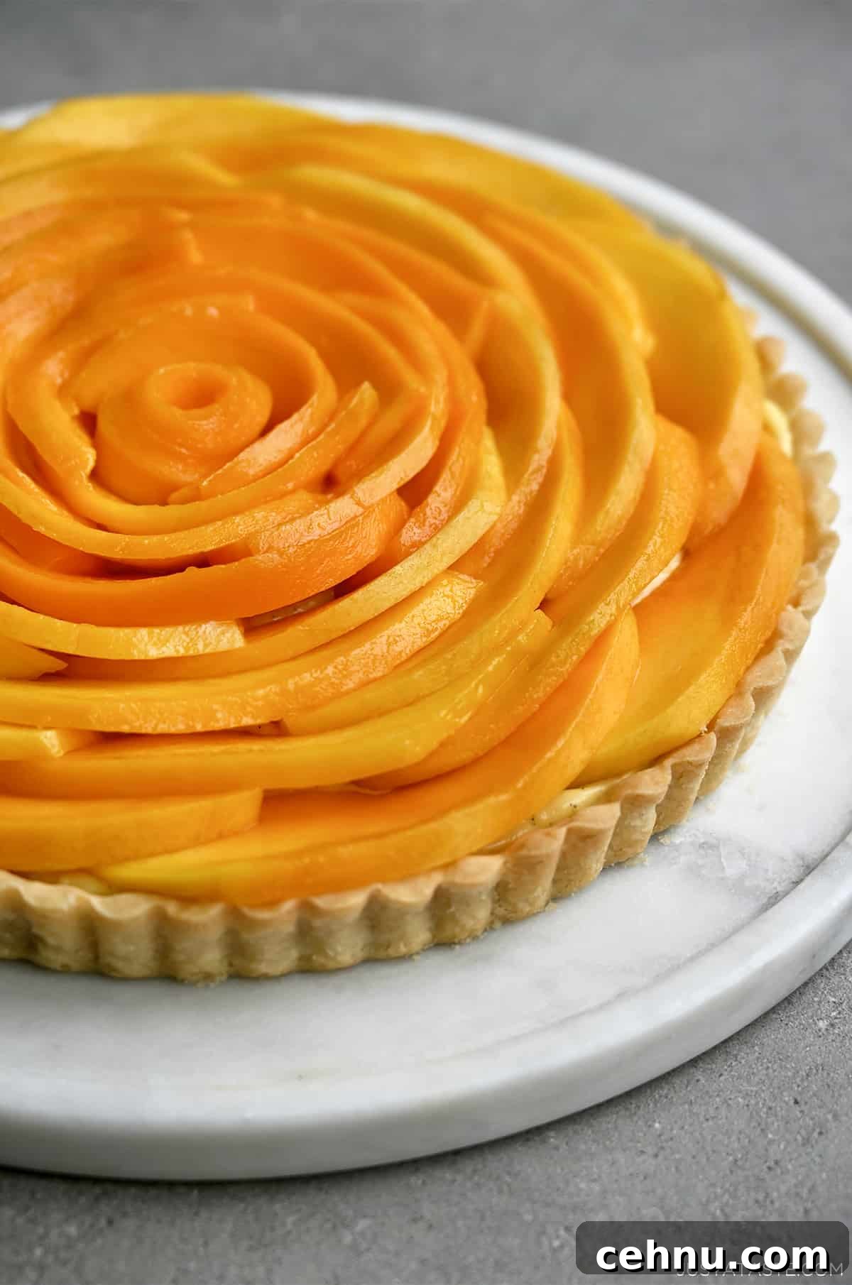 A mango tart with vanilla pastry cream.