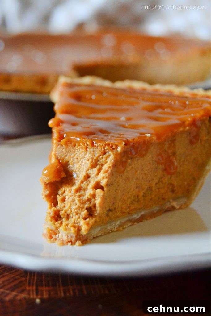 closeup of a salted caramel pumpkin pie with a bite missing