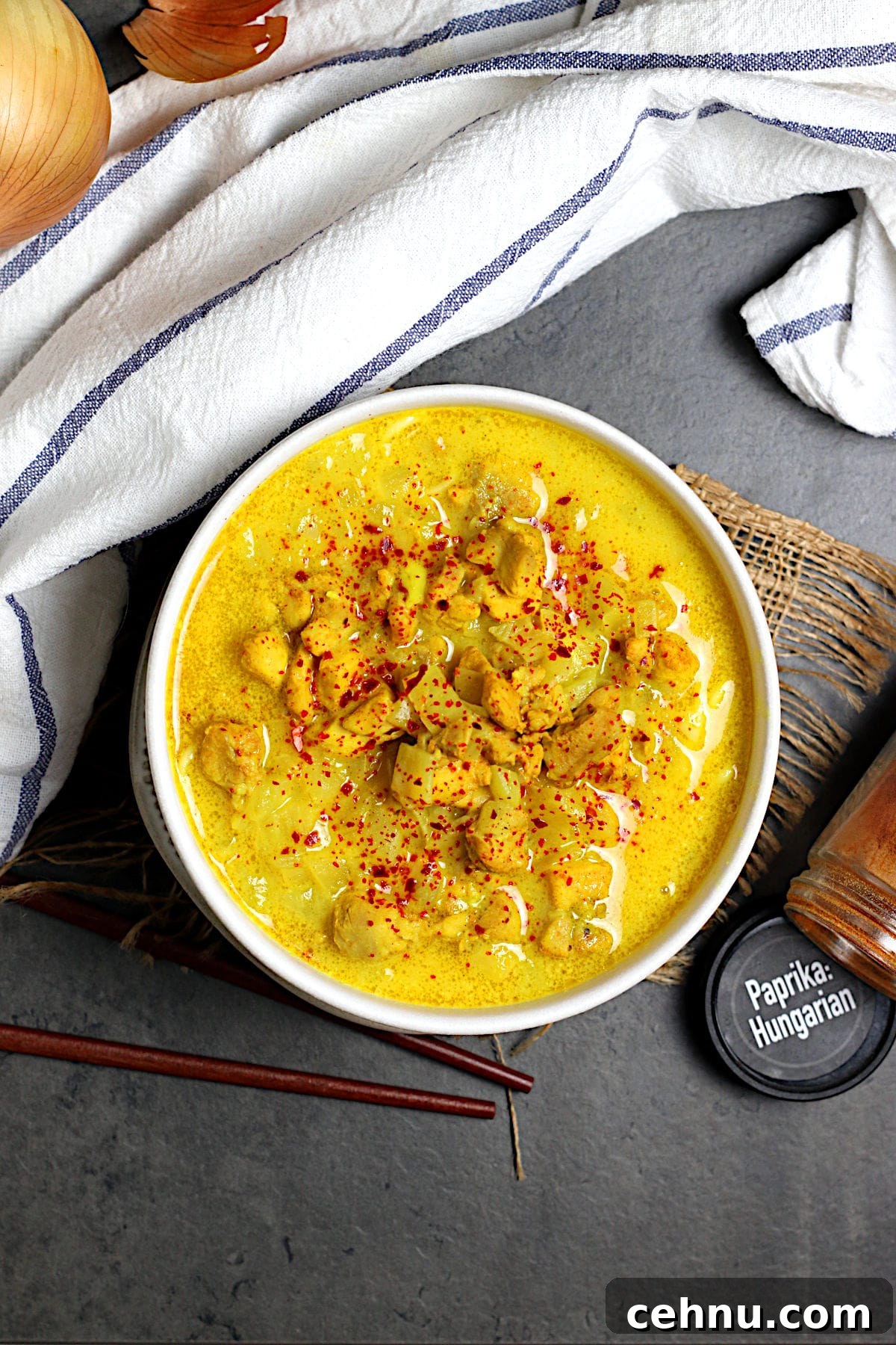Overhead photo of Burmese Coconut Chicken Noodle Soup in a white bowl.