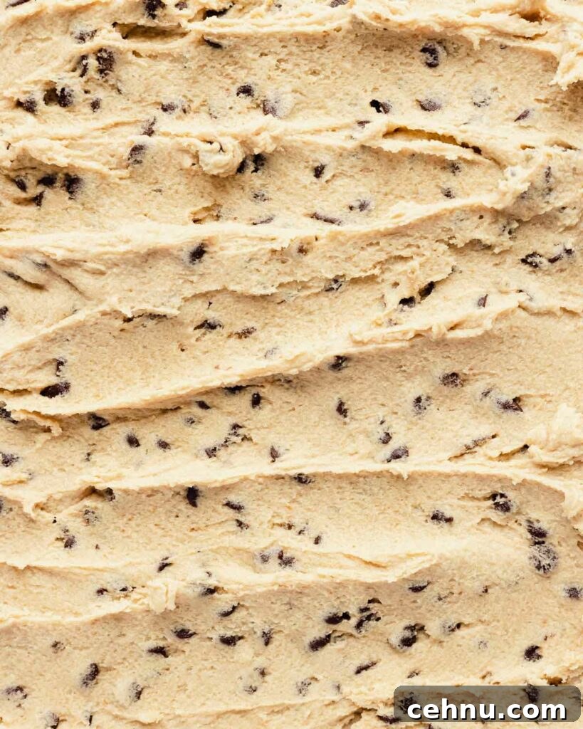 edible cookie dough spread on a sheet with chocolate chips