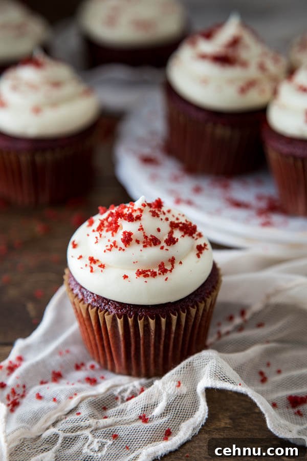 Red velvet cupcakes on a brown table top and white linen