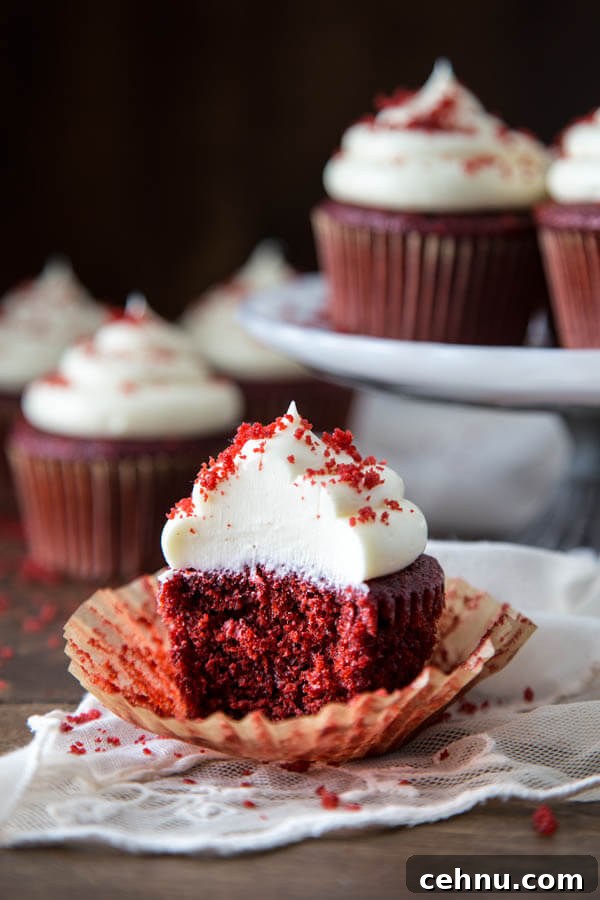 A red velvet cupcake with a bite taken out