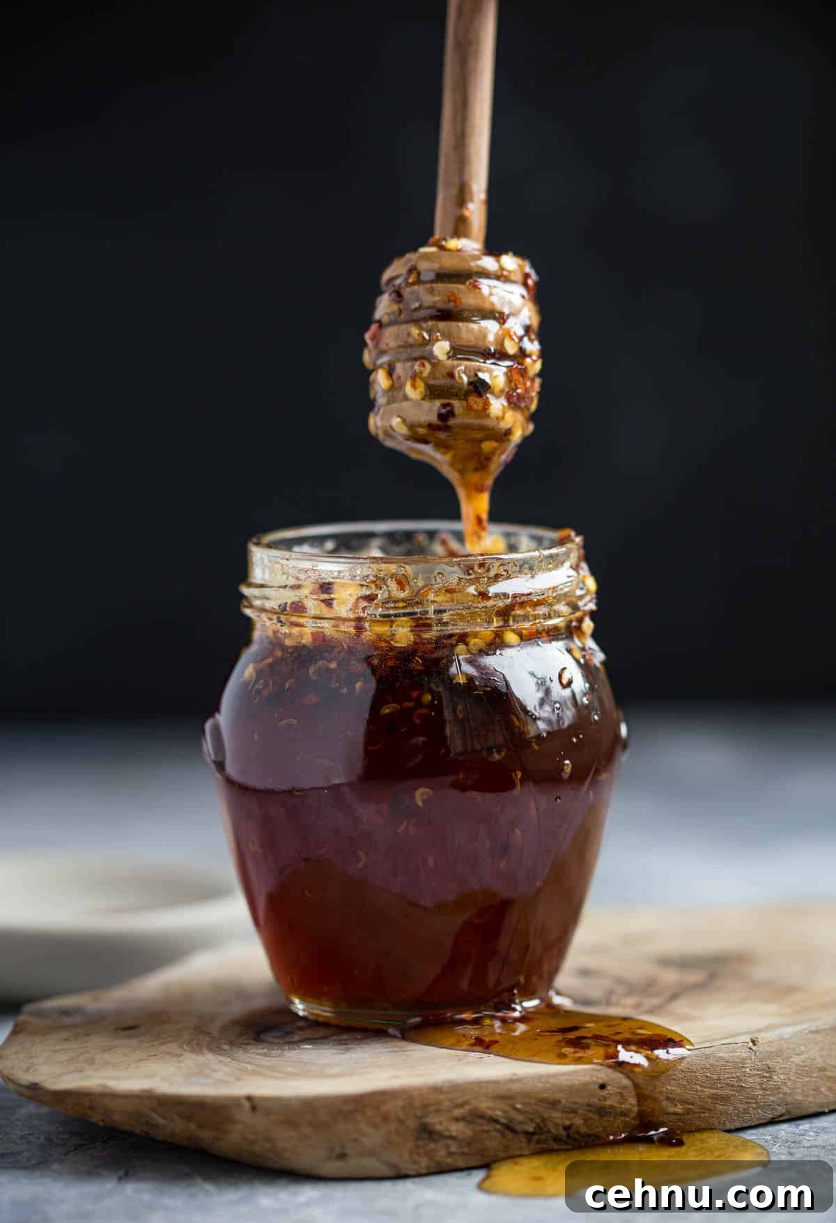 Hot honey in a small mason jar.