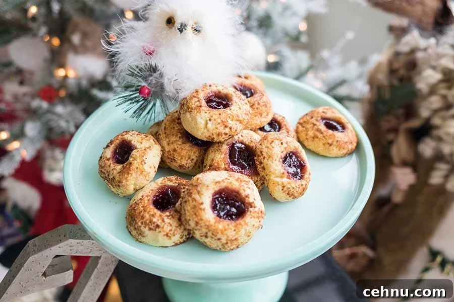 20 Gluten-Free Cookie Recipes for Holiday Parties and Gifts 19 gluten-free thumbprint cookies with jam in the center on a platter