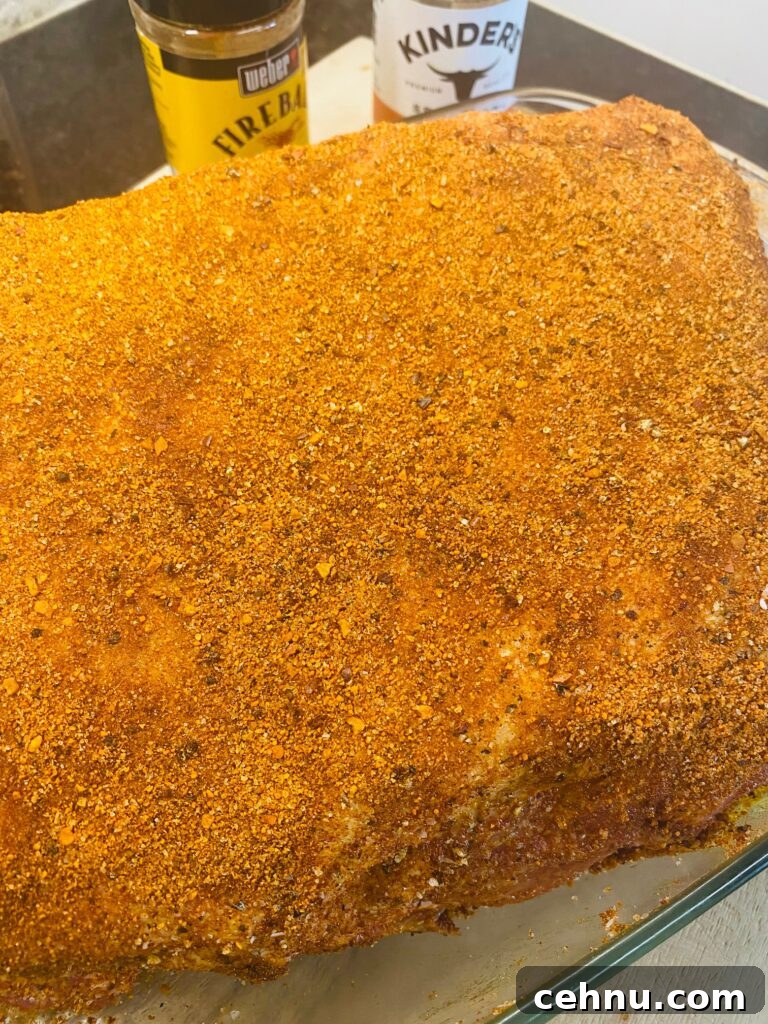 Smoked Pulled Pork with Fireball Cinnamon Whiskey Glaze 4 seasoned pork shoulder before cooking