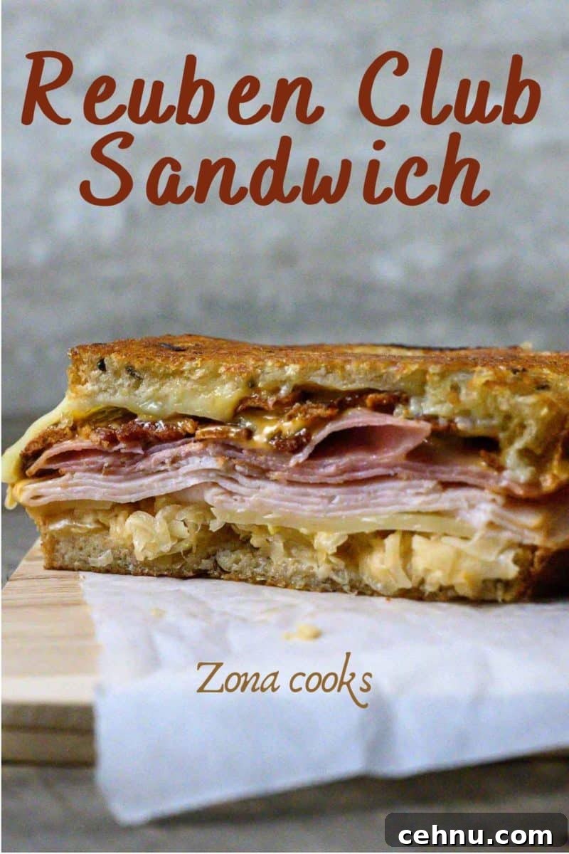 Reuben Club Sandwich with Corned Beef, Swiss and Sauerkraut 2 Reuben Sandwich with Ham cut open on parchment paper.