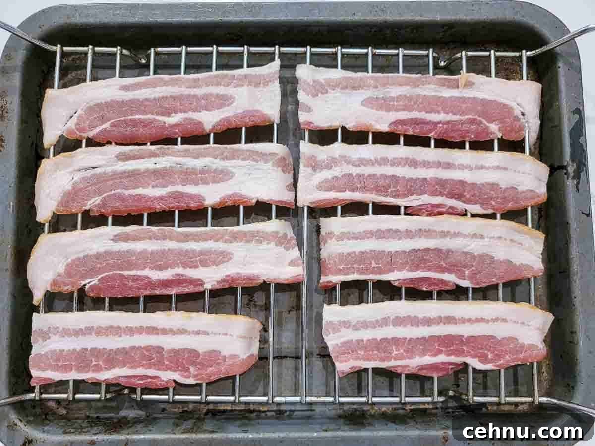 Reuben Club Sandwich with Corned Beef, Swiss and Sauerkraut 3 8 half bacon slices on a wire rack over a baking sheet.