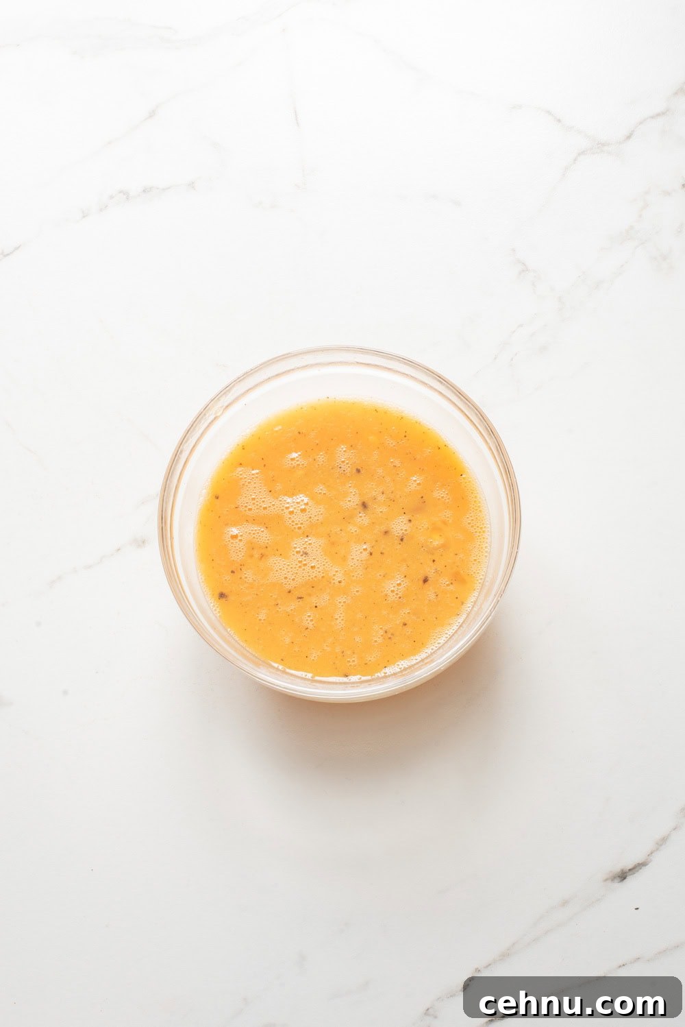 An overhead image of whisking the eggs together.