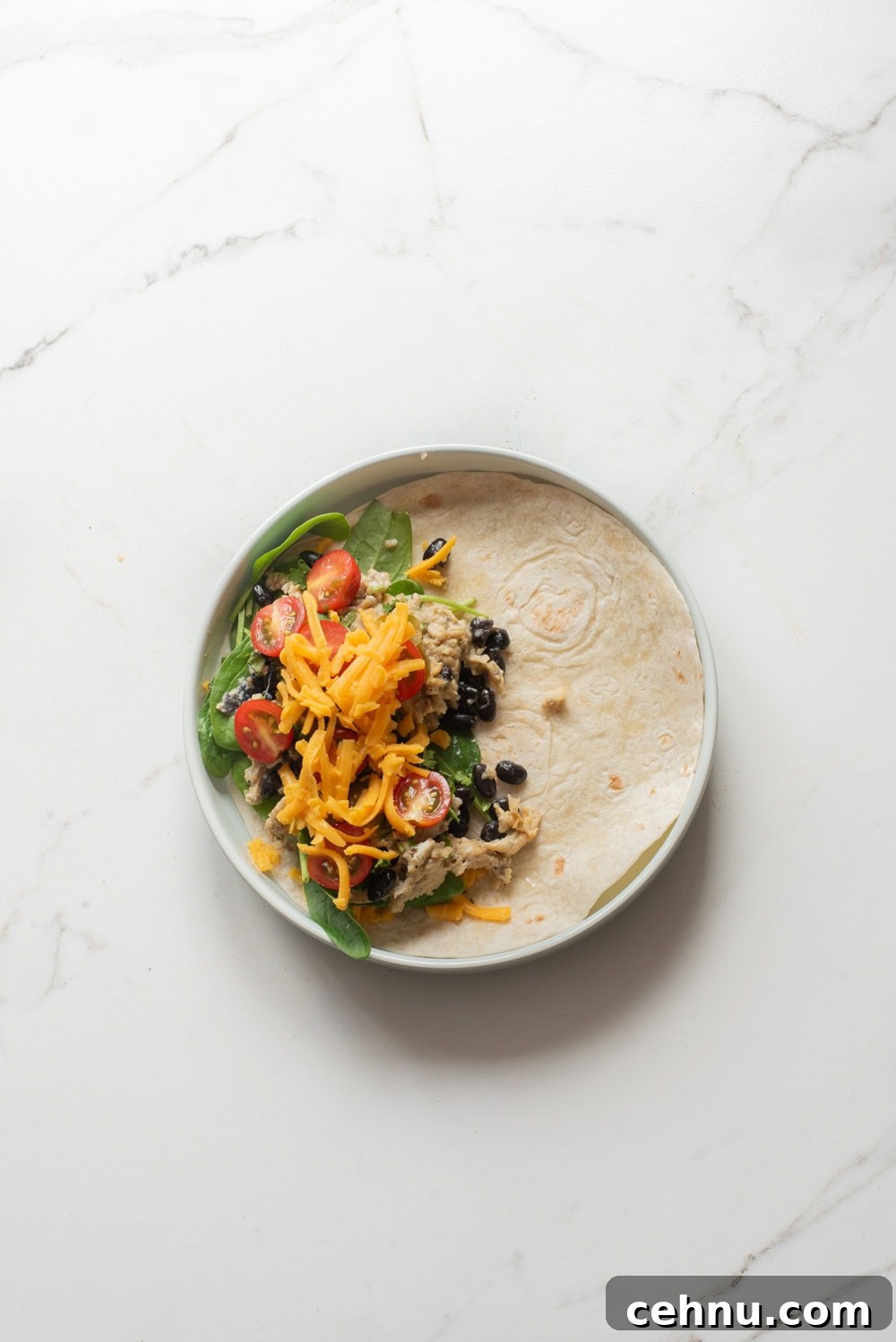 An overhead image of assembling the vegetarian quesadilla.