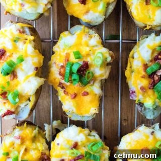 Quick Twice Baked Potatoes are super creamy, loaded up with cheese, bacon and green onions and are ready to eat in just 30 minutes.