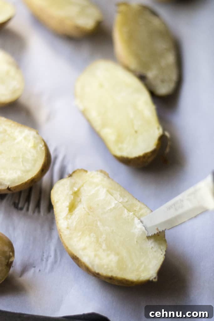 How to Make Twice-Baked Potatoes: Microwave to Oven 5 Knife inserted into a baked potato