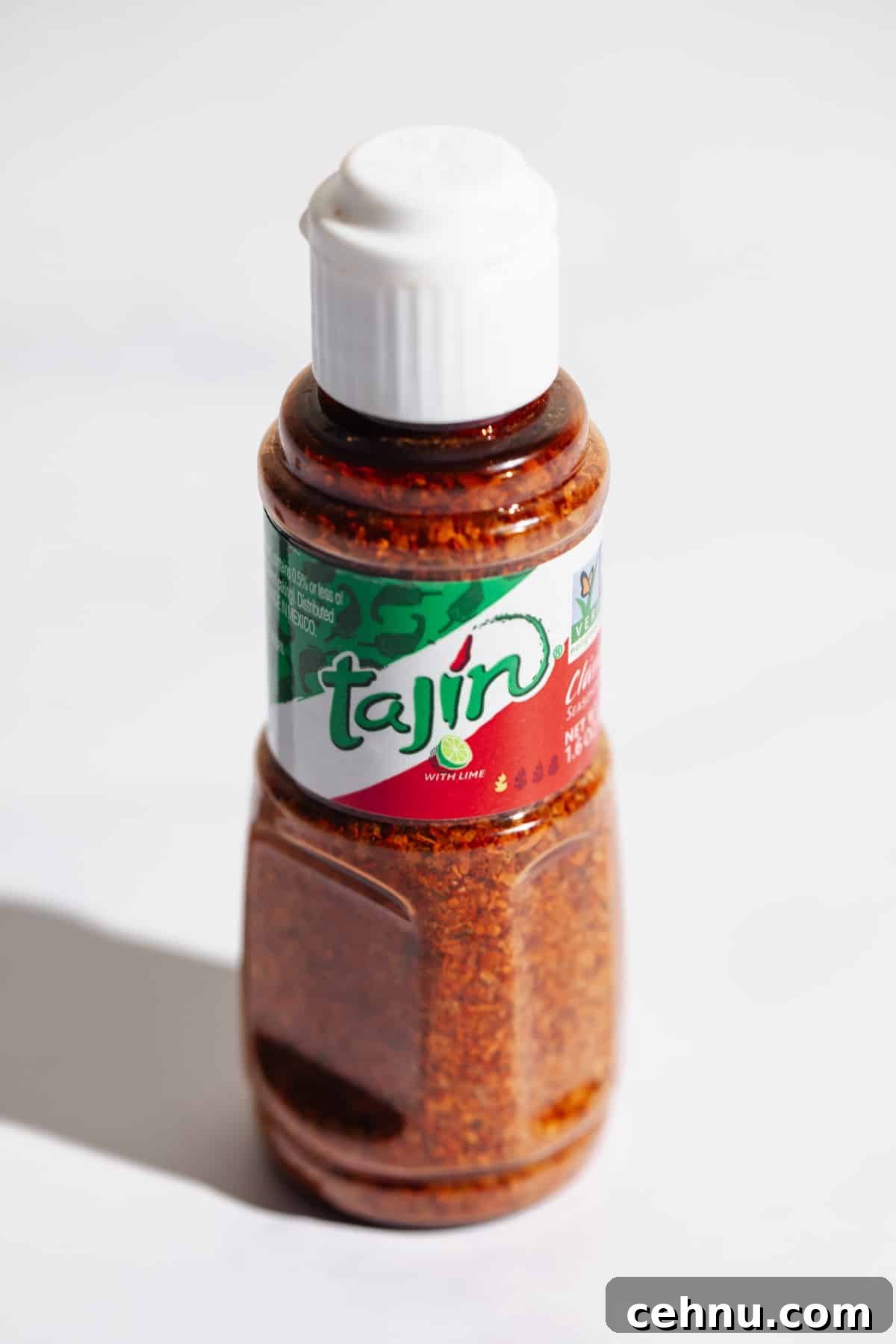 Tajin Seasoning: What It Is and How to Use It 2 A bottle of tajin seasoning un-opened.