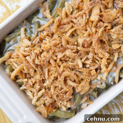green bean casserole topped with fried onions in a casserole dish.