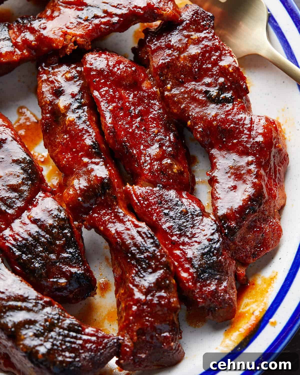 Oven-Baked Country-Style Boneless Pork Ribs 5 Up close image of boneless pork ribs in the oven recipe.