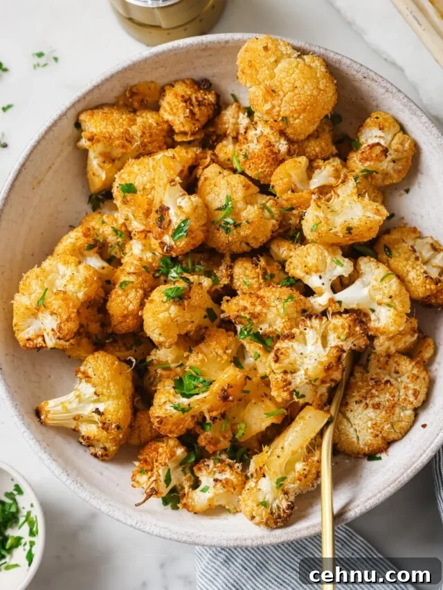 Easter Menu Ideas: Brunch, Dinner and Dessert Recipes 17 Roasted Cauliflower on a white serving dish.