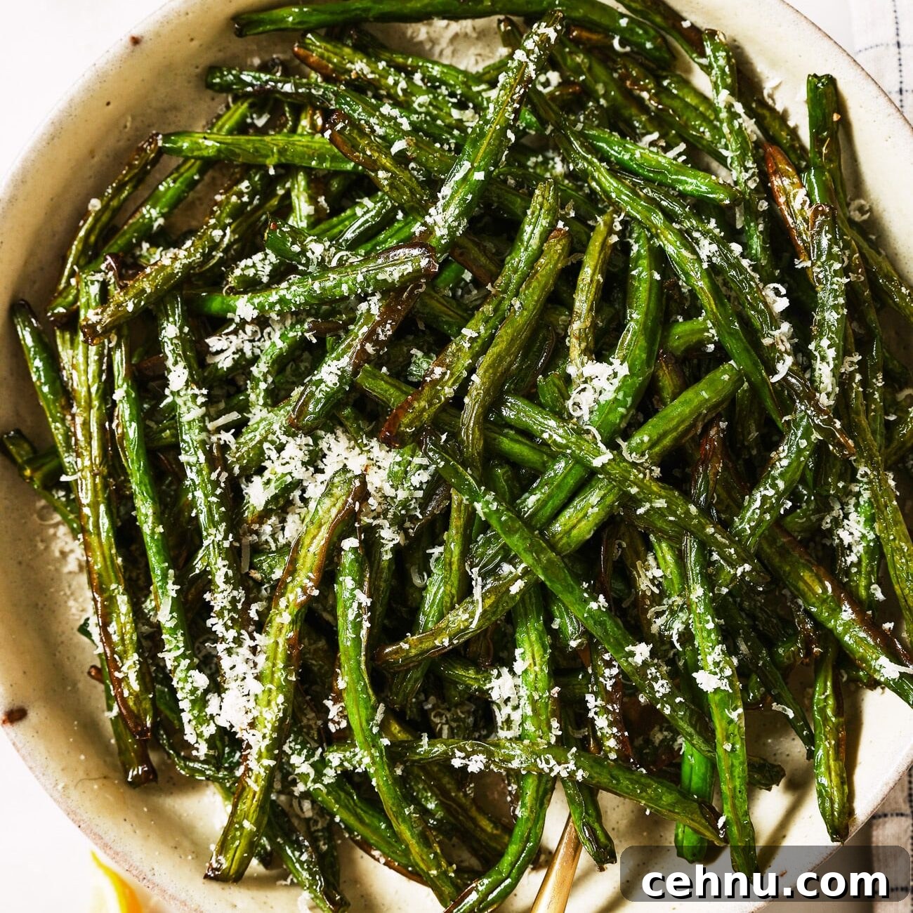 Easter Menu Ideas: Brunch, Dinner and Dessert Recipes 22 Air fryer green beans in a white serving dish.