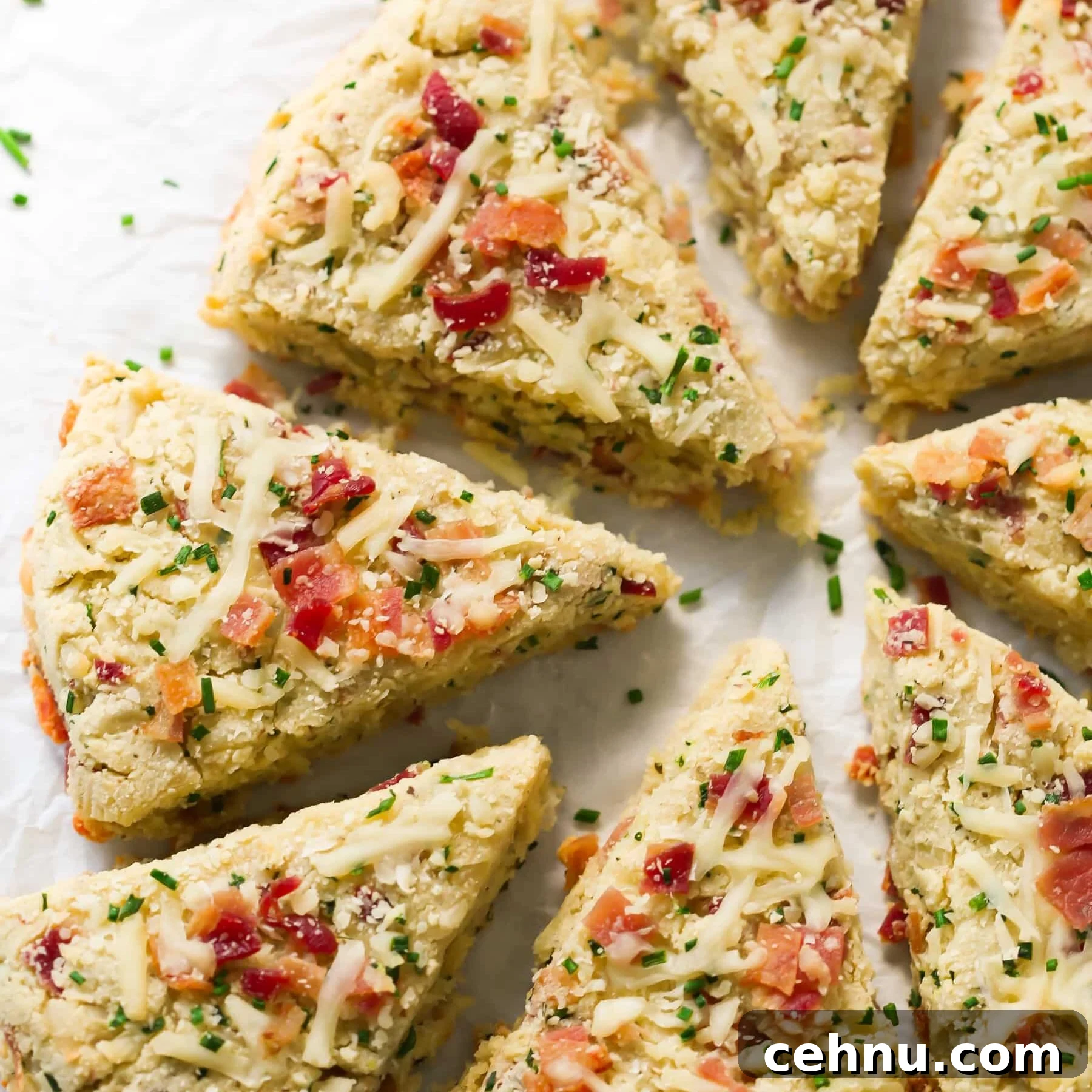 Easter Menu Ideas: Brunch, Dinner and Dessert Recipes 6 Bacon and cheese scones on parchment paper.