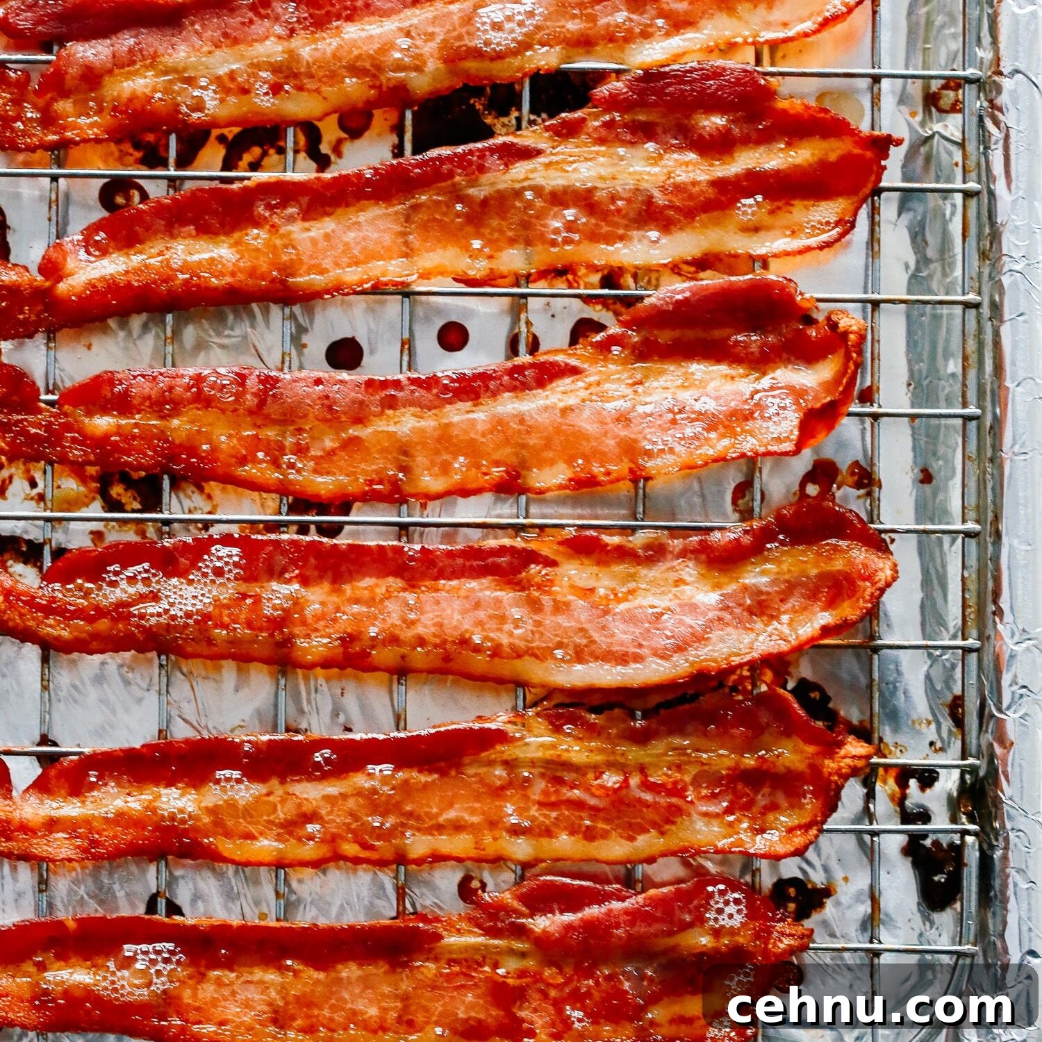 Easter Menu Ideas: Brunch, Dinner and Dessert Recipes 9 Cooked bacon on a wire rack atop a foil lined baking sheet.
