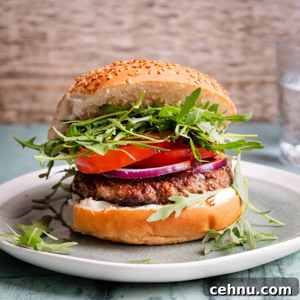 tamarind lamb burger in a bun with salad
