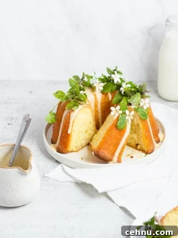 slice bundt cake with bowl of icing nearby