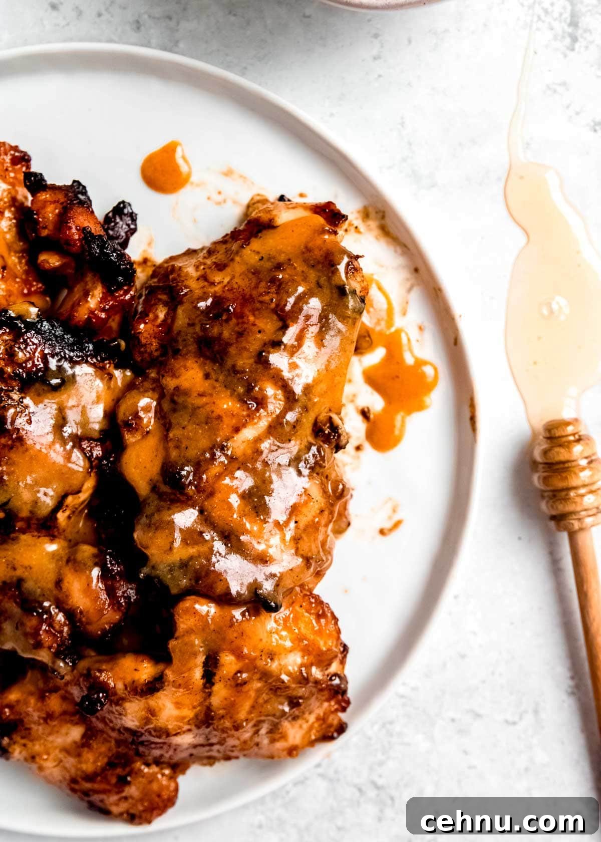 overhead image of honey mustard chicken on white plate 