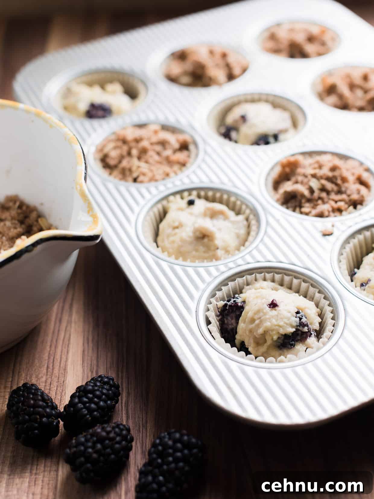 Moist Blackberry Yogurt Muffins with Lemon Zest 4 Muffin tin filled with Blackberry Yogurt Muffins ready to be baked.