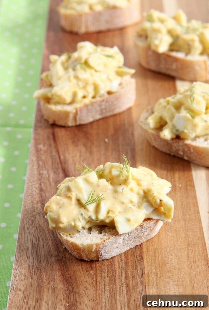 Deviled Egg bruschetta on wooden platter