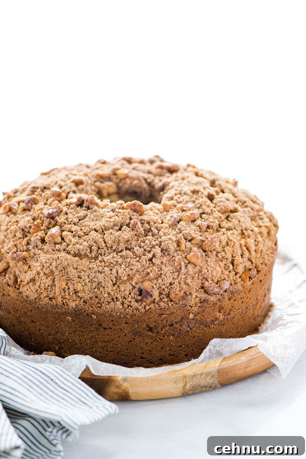 baked Gluten Free Sour Cream Coffee Cake Recipe ready to serve on a wax paper lined wood platter