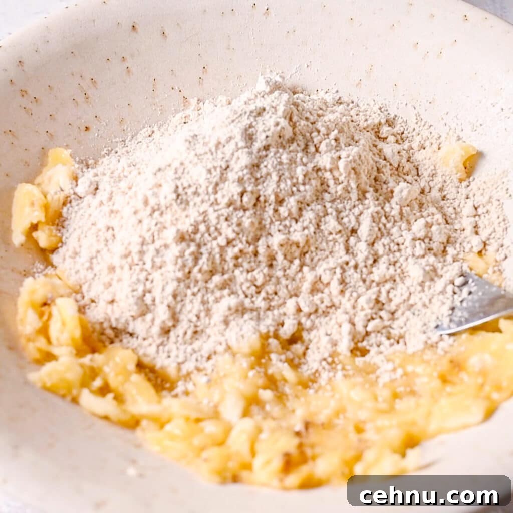 3-Ingredient Banana Bread Recipe: Moist and Quick 6 Adding self-rising flour to mashed bananas for 3 ingredient banana bread