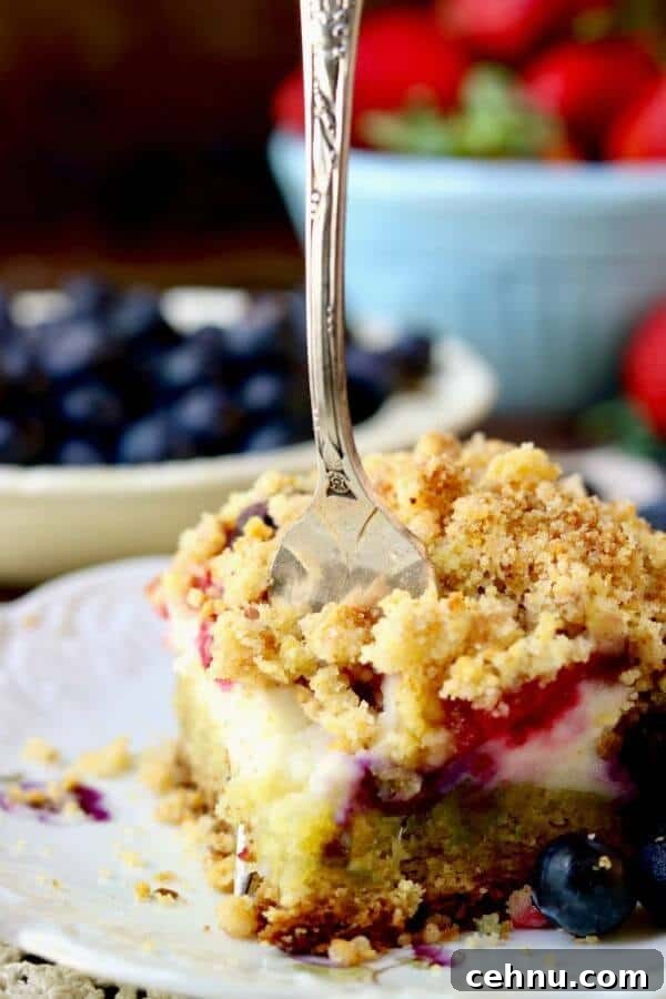 Closeup of a fork cutting through a serving of coffee cake showing the different layers.