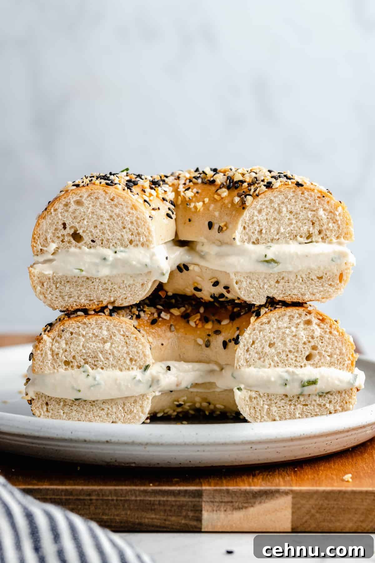 Cream cheese on a bagel cut in half.
