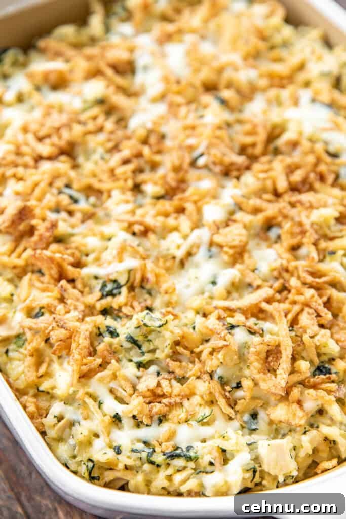 Casserole dish filled with chicken, spinach and rice casserole