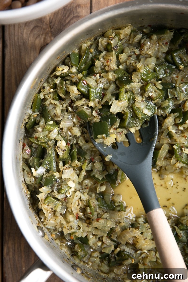 Smoky Poblano Drunken Beans 3 A fun and flavorful twist on boring bland beans, these easy Drunken Beans with Poblanos taste fantastic eaten alone or paired with all your favorite Mexican dishes.