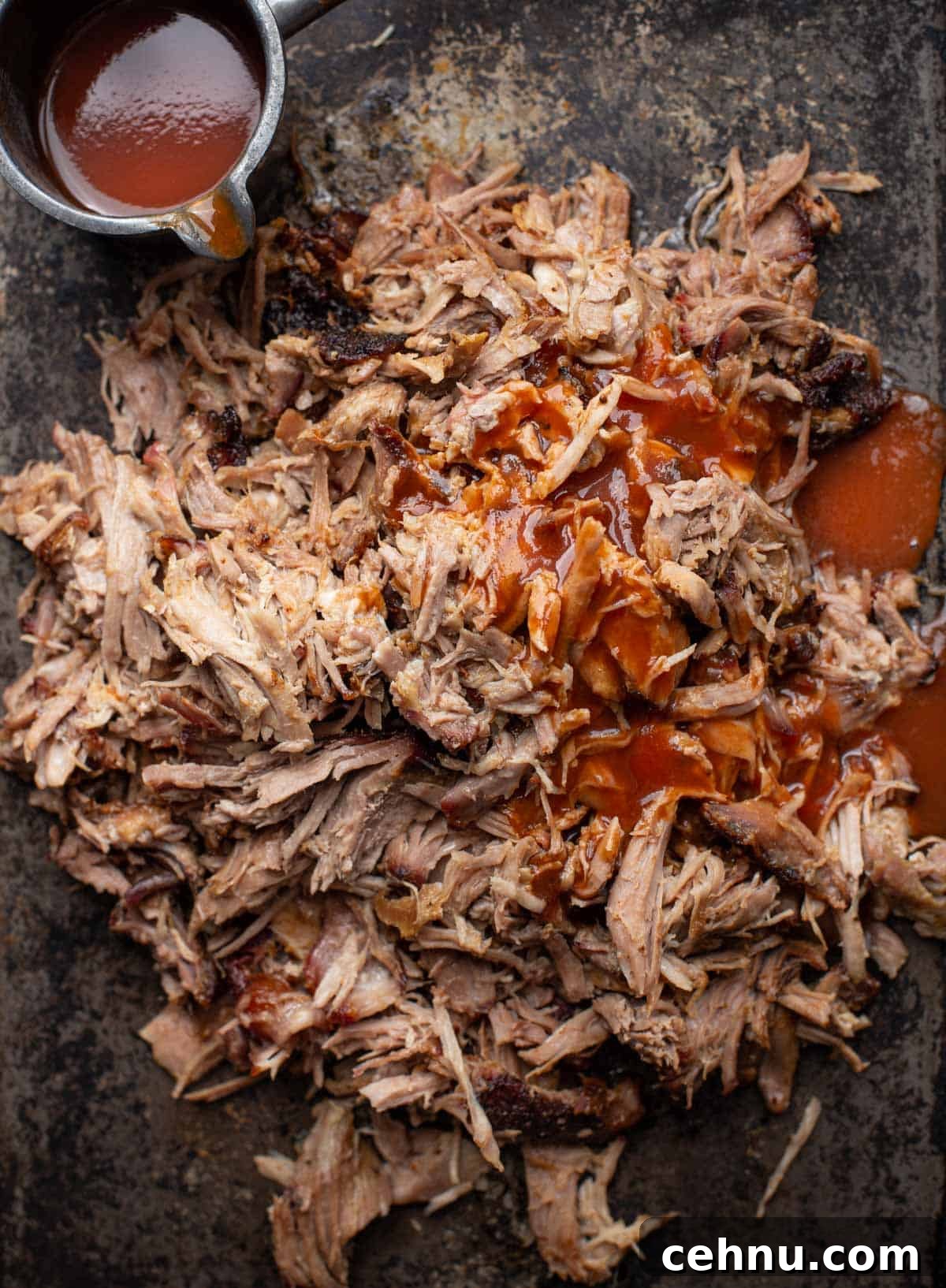Smoked Pork Butt Recipe for Tender, Juicy Pulled Pork 2 Smoked pulled pork on a sheetpan