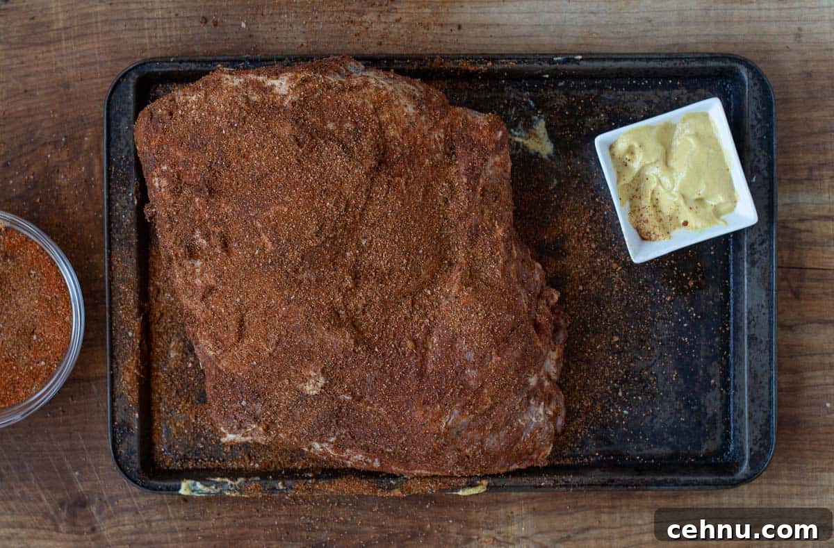 Smoked Pork Butt Recipe for Tender, Juicy Pulled Pork 8 A seasoned bone-in pork butt.