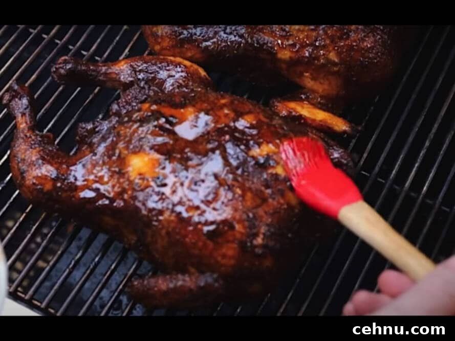 Basting the chicken with butter and rub