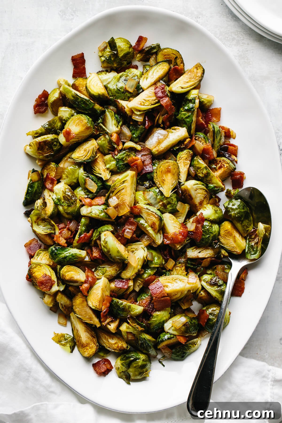 Thanksgiving Menu Ideas and Classic Holiday Recipes 12 Balsamic bacon brussels sprouts on a serving platter.