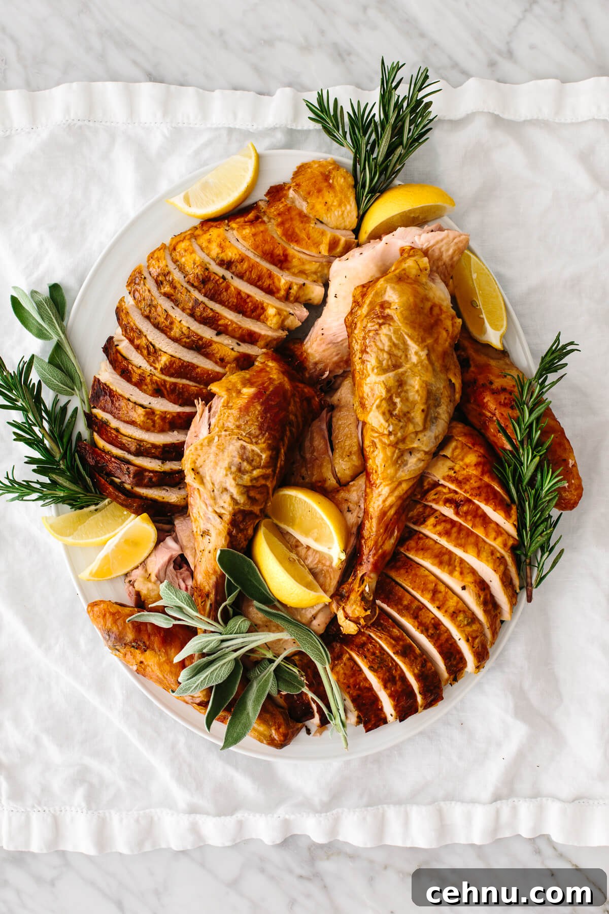 Thanksgiving Menu Ideas and Classic Holiday Recipes 13 Carved turkey on a serving dish on a table.